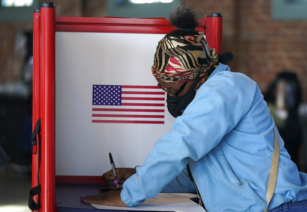 In this Tuesday, Nov. 3, 2020, file photo, Johnea Barlow casts her ballot at the Kentucky Center for African American Heritage, on Election Day in Louisville, Ky. (AP Photo/Darron Cummings, File)