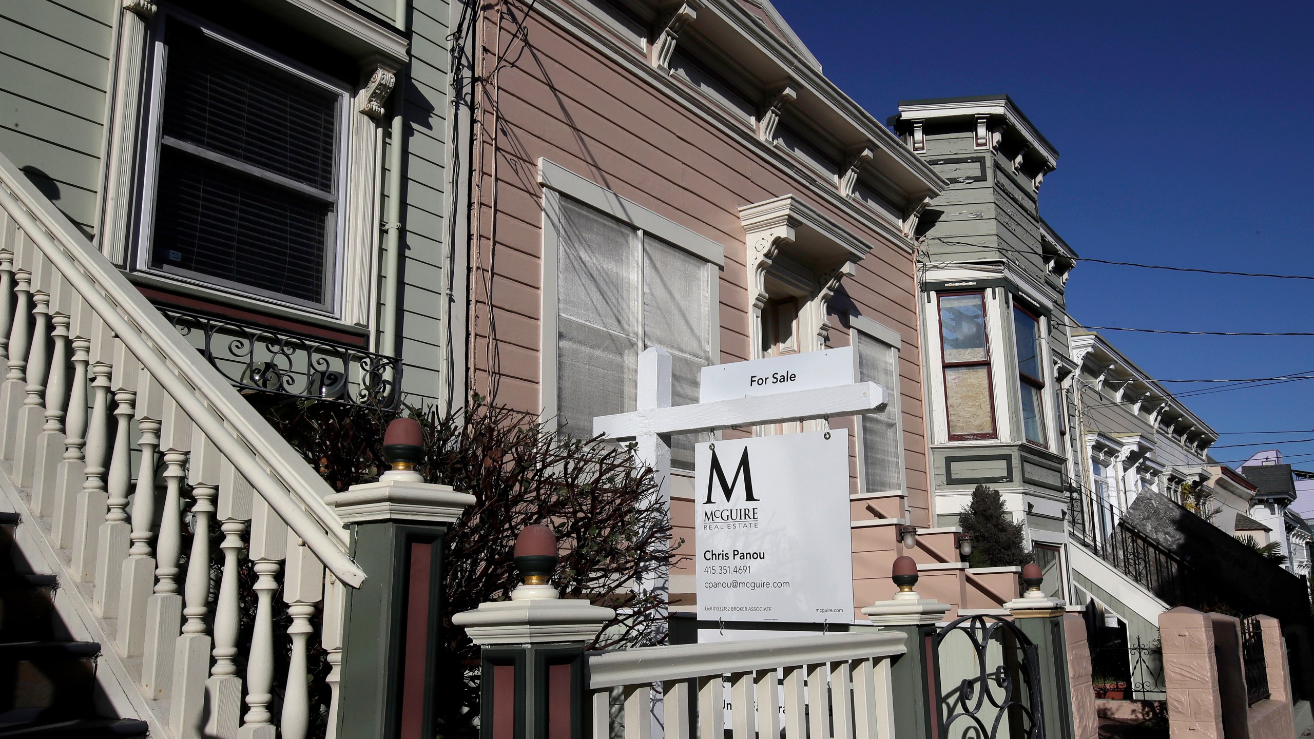 In this Feb. 18, 2020, file photo a real estate sign is shown in front of a home for sale in San Francisco. (AP Photo/Jeff Chiu, File)