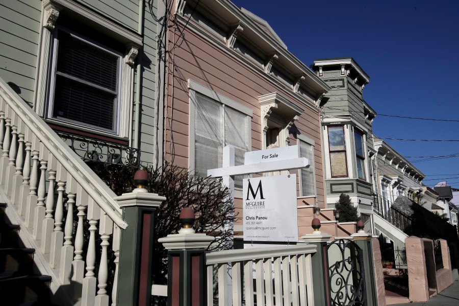 In this Feb. 18, 2020, file photo a real estate sign is shown in front of a home for sale in San Francisco. (AP Photo/Jeff Chiu, File)