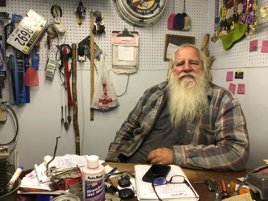 Danny Rice, 67, discusses the coronavirus in his auto repair shop in downtown Elmwood, Nebraska, on Monday, Nov. 9, 2020. (Grant Schulte/AP Photo)