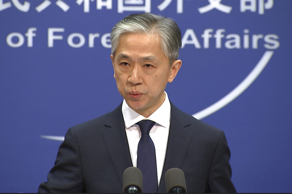 Chinese foreign ministry spokesman, Wang Wenbin, speaks during a routine press conference where he congratulated U.S. president-elect Joe Biden at the foreign ministry in Beijing on Friday, Nov. 13, 2020. (AP Photo/Liu Zheng)