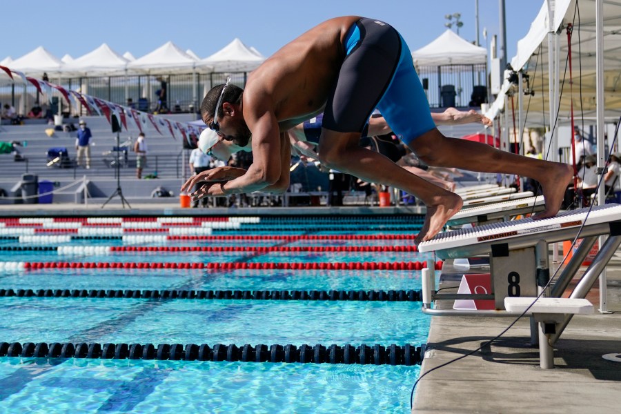 Ous Mellouli dives in for the men's 400 meter freestyle at the U.S. Open swimming championships on Nov. 13, 2020, in Irvine, Calif. (AP Photo/Ashley Landis)