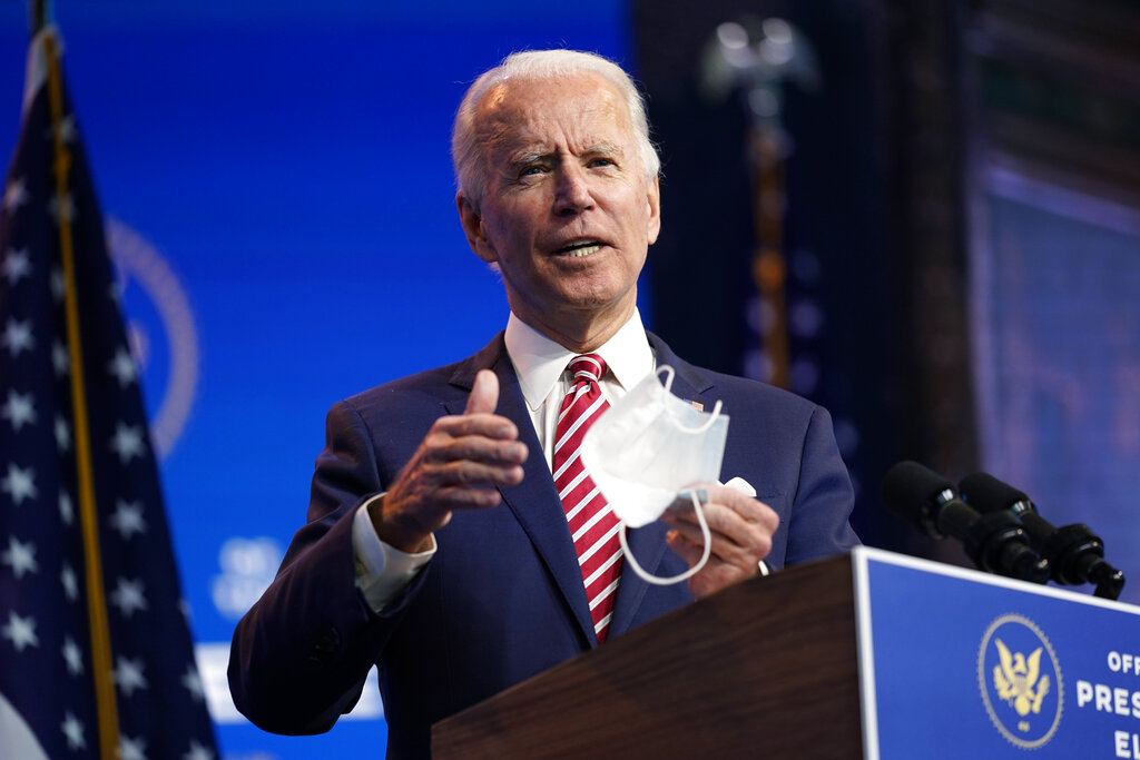 President-elect Joe Biden, accompanied by Vice President-elect Kamala Harris, speaks about economic recovery at The Queen theater, Monday, Nov. 16, 2020, in Wilmington, Del. (AP Photo/Andrew Harnik)