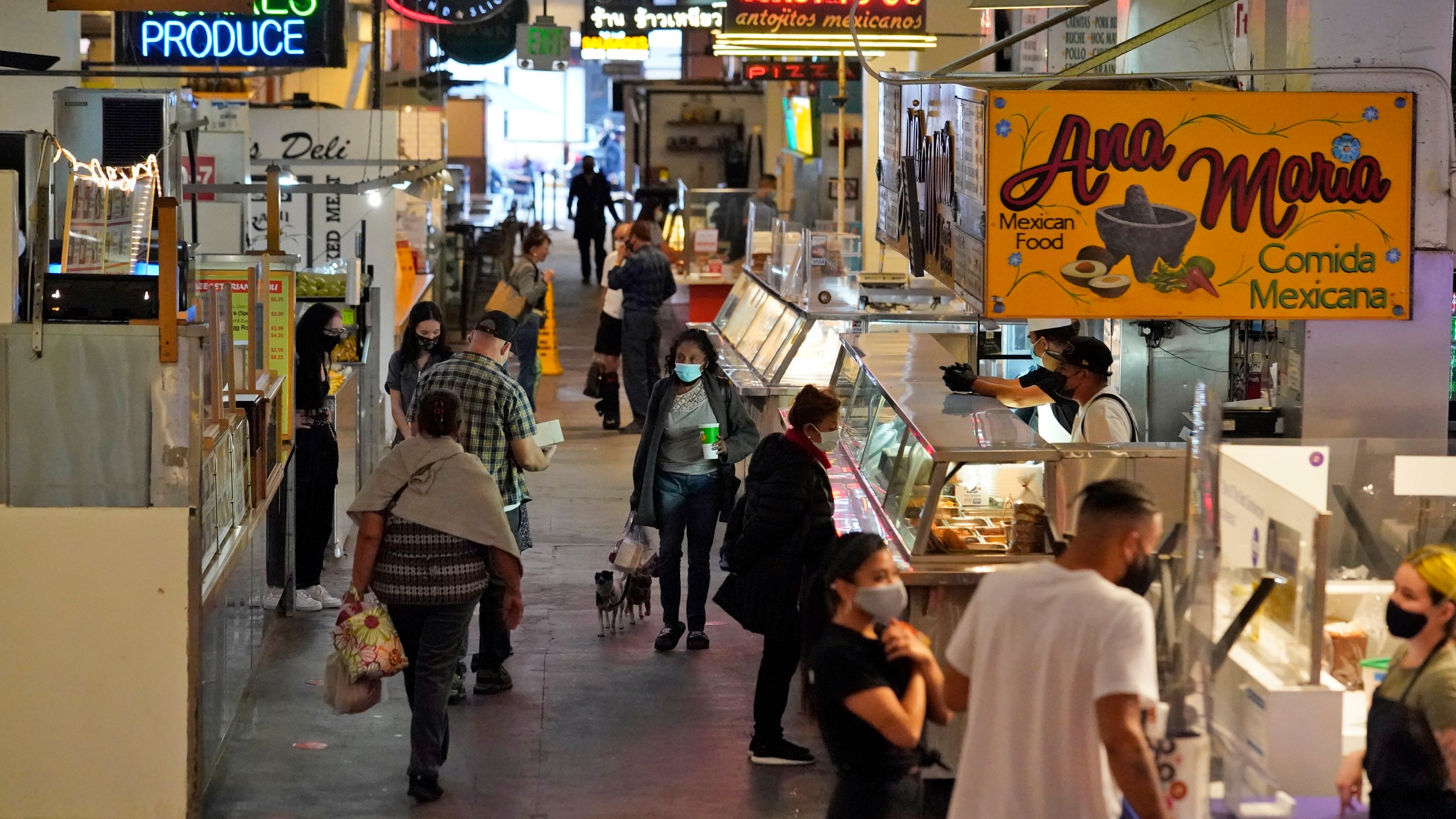 Customers walk the aisles at the Grand Central Market in in Los Angeles on Nov. 16, 2020. (Marcio Jose Sanchez / Associated Press)