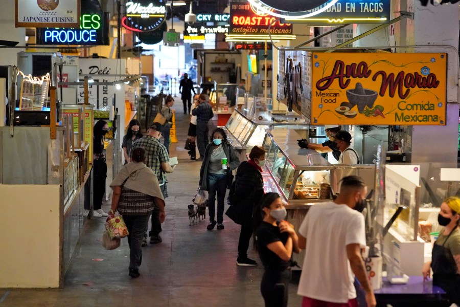 Customers walk the aisles at the Grand Central Market in in Los Angeles on Nov. 16, 2020. (Marcio Jose Sanchez / Associated Press)