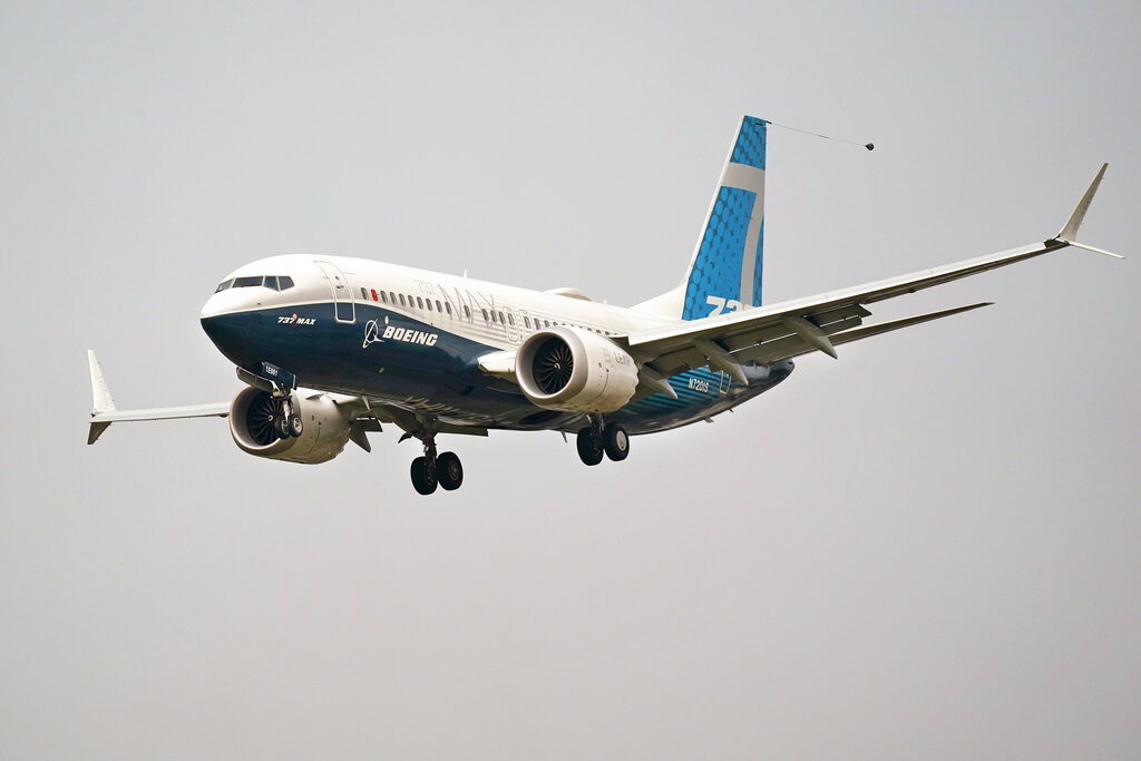 In this Wednesday, Sept. 30, 2020, file photo, a Boeing 737 Max jet, piloted by Federal Aviation Administration Chief Steve Dickson, prepares to land at Boeing Field following a test flight in Seattle. (AP Photo/Elaine Thompson, File)