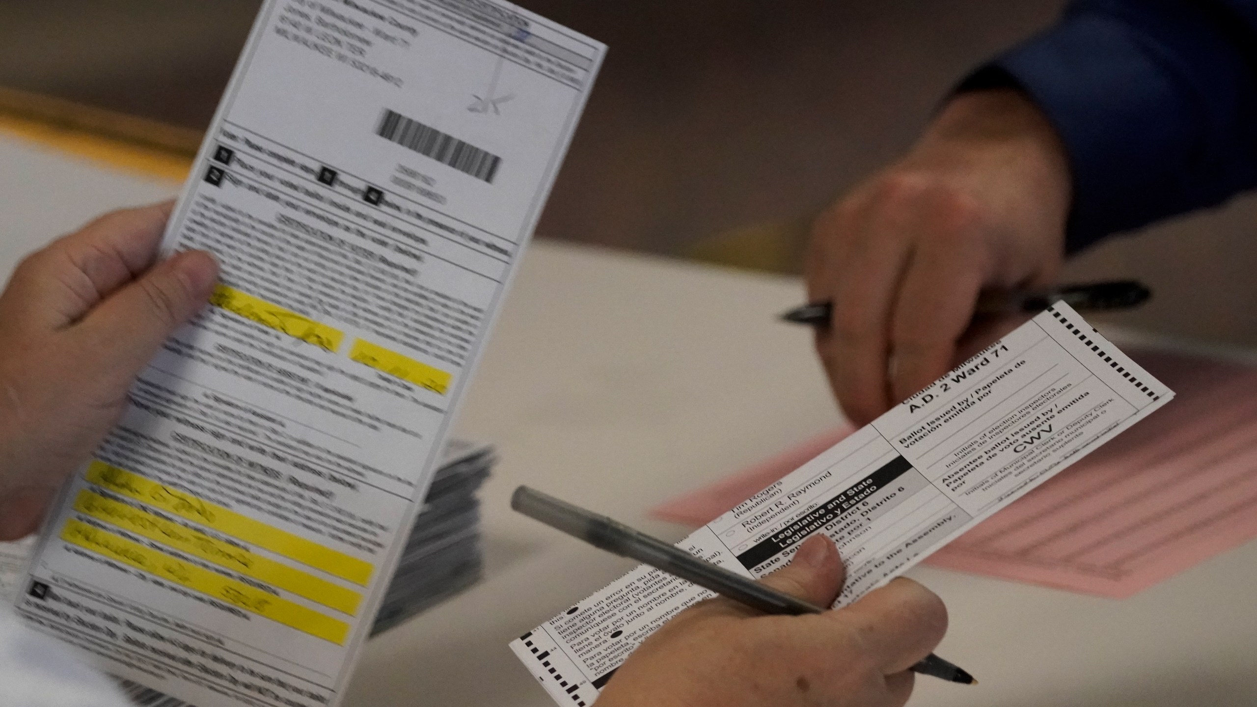 In this Nov. 3, 2020 file photo, workers count Milwaukee County ballots on Election Day at Central Count in Milwaukee. President Donald Trump's campaign has paid $3 million for a recount of two heavily Democratic Wisconsin counties, saying Wednesday, Nov. 18, 2020, that they were the site of the "worst irregularities" although no evidence of wrongdoing has been presented and state elections officials have said there was none. (AP Photo/Morry Gash File)