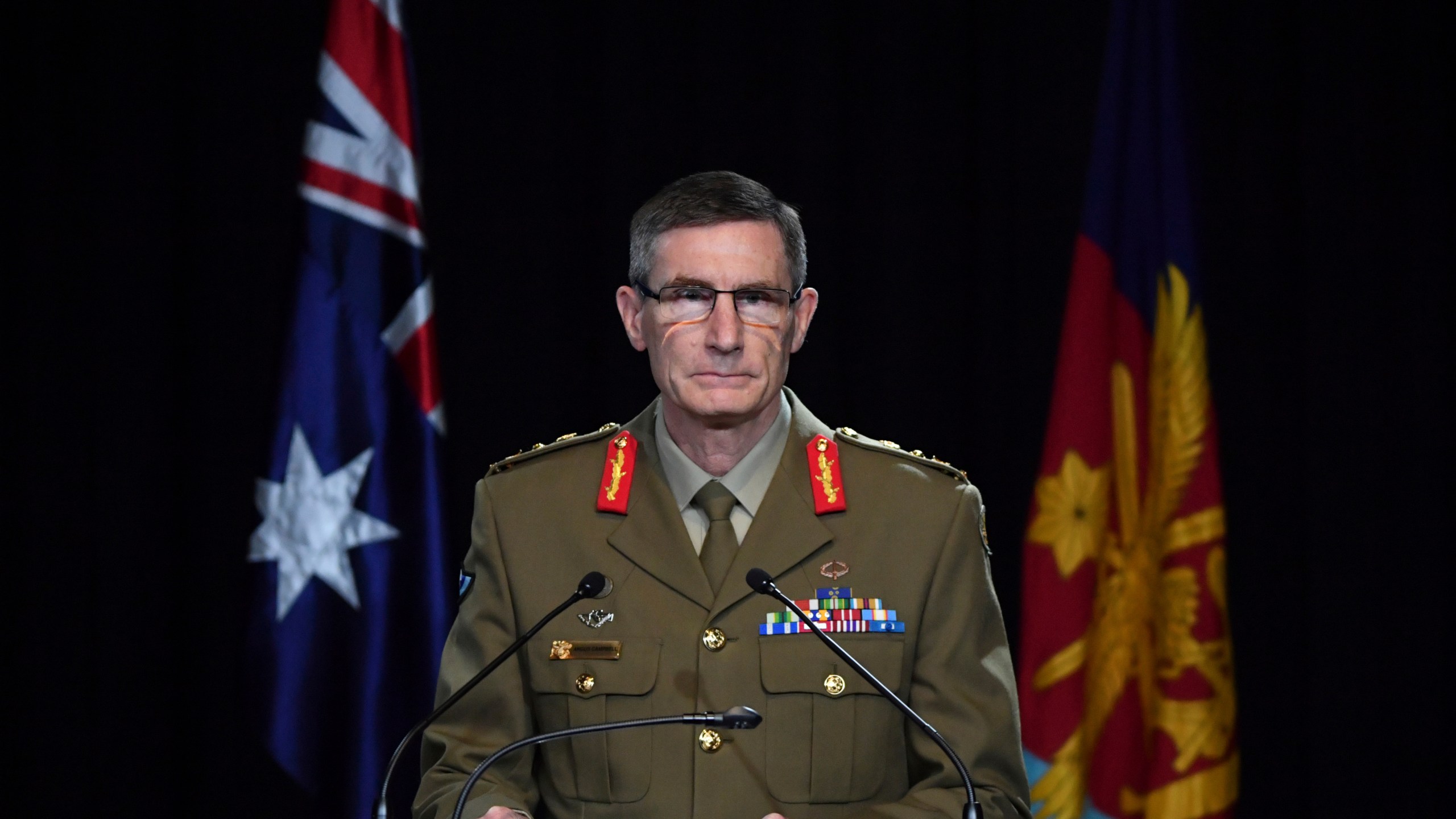 Chief of the Australian Defence Force Gen. Angus Campbell delivers the findings from the Inspector-General of the Australian Defence Force Afghanistan Inquiry, in Canberra, Thursday, Nov. 19, 2020. (Mick Tsikas/Pool Photo via AP)