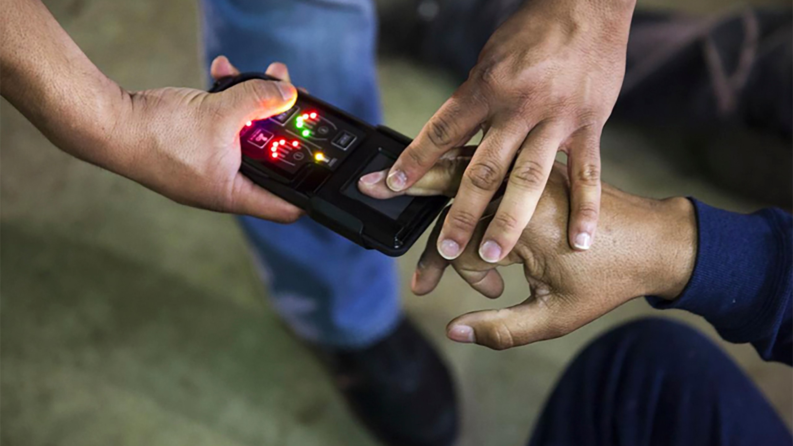 This undated photo obtained from Immigration and Customs Enforcement (ICE) shows a NeoScan 45 fingerprint scanner. The device, paired with an app known as EDDIE, is used by ICE to run remote ID checks.(Immigration and Customs Enforcement via AP)