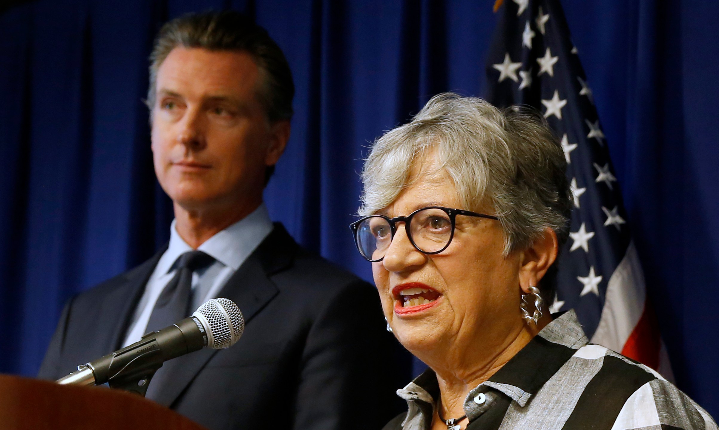 In this Sept. 18, 2019, file photo, California Air Resources Board Chair Mary Nichols, with California Gov. Gavin Newsom at left, discusses the Trump administration's pledge to revoke California's authority to set vehicle emissions standards that are different than the federal standards, during a news conference in Sacramento. (Rich Pedroncelli / Associated Press)