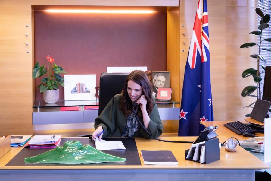 In this photo provided by New Zealand Prime Minister's Office, Prime Minister Jacinda Ardern talks with U.S. President-elect Joe Biden on phone at her office in Wellington, New Zealand, Monday, Nov. 23, 2020. (New Zealand Prime Minister's Office via AP)