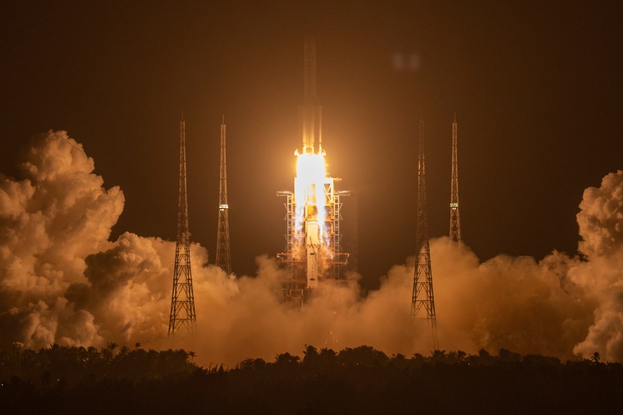 A Long March-5 rocket carrying the Chang'e 5 lunar mission lifts off at the Wenchang Space Launch Center in Wenchang in southern China's Hainan Province on Nov. 24, 2020. (AP Photo/Mark Schiefelbein)