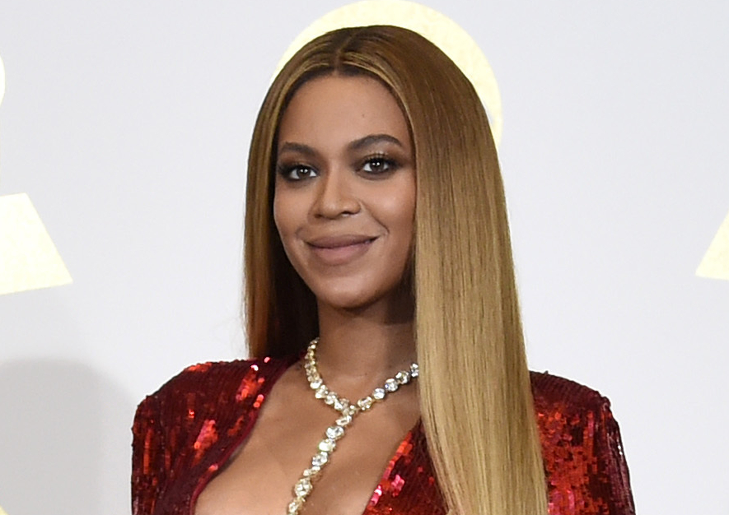 In this Feb. 12, 2017 file photo, Beyonce poses in the press room at the 59th annual Grammy Awards in Los Angeles. The pop star scored multiple Grammy nominations Tuesday, making her the leading contender with nine nominations. (Photo by Chris Pizzello/Invision/AP, File)