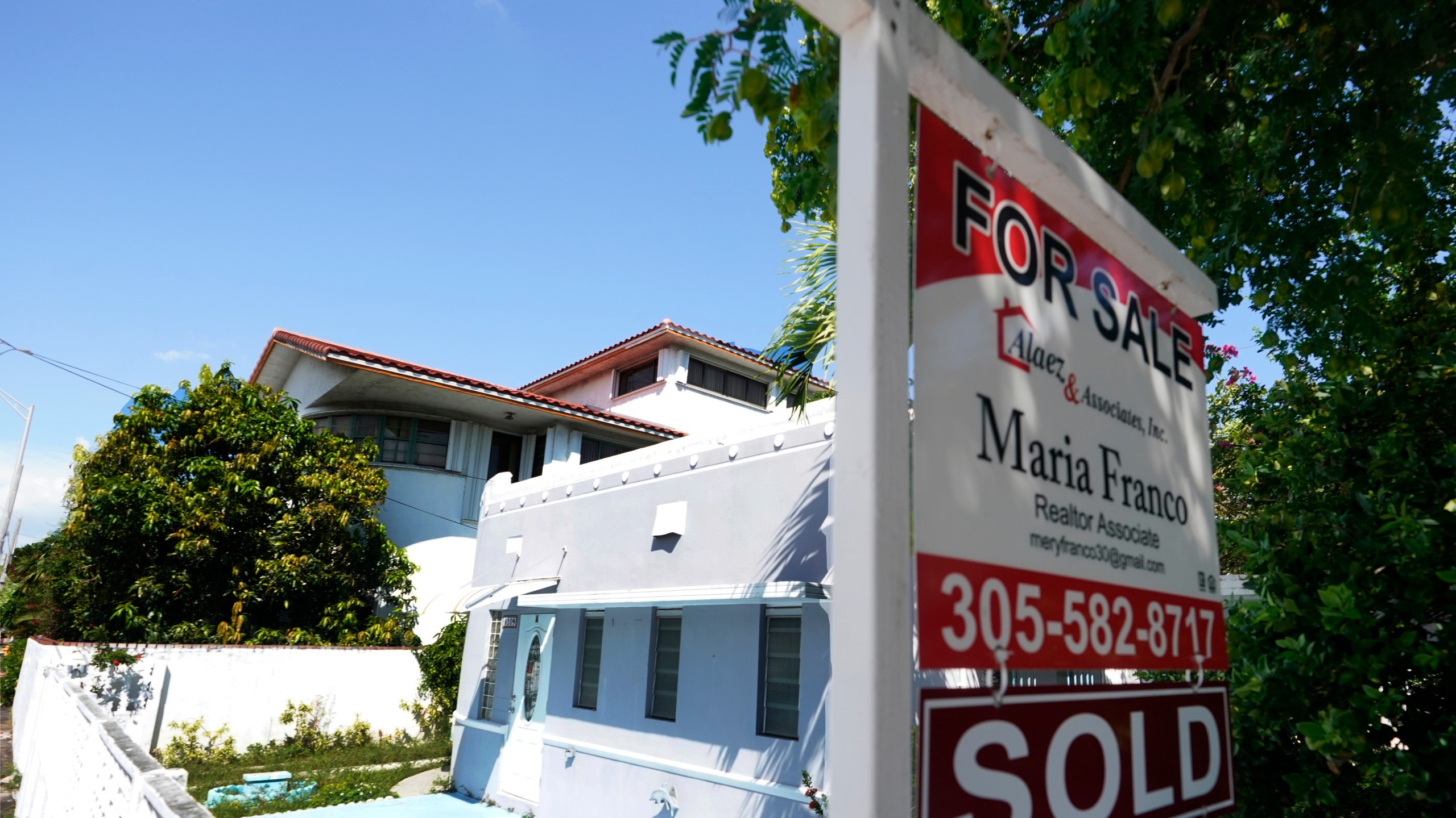 A home for sale with a "sold" sign attached is viewed Monday, Oct. 12, 2020, in Miami Beach, Fla. (AP Photo/Wilfredo Lee)