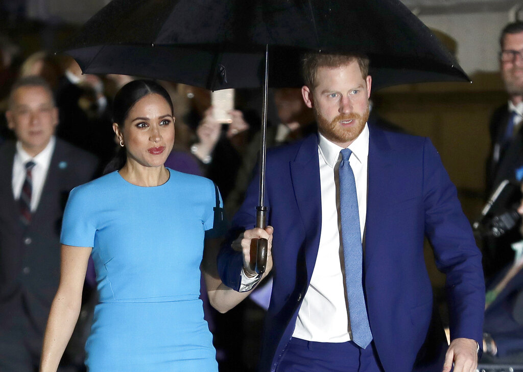 Prince Harry and Meghan, the Duke and Duchess of Sussex arrive at the annual Endeavour Fund Awards in London on March 5, 2020. (AP Photo/Kirsty Wigglesworth, File)