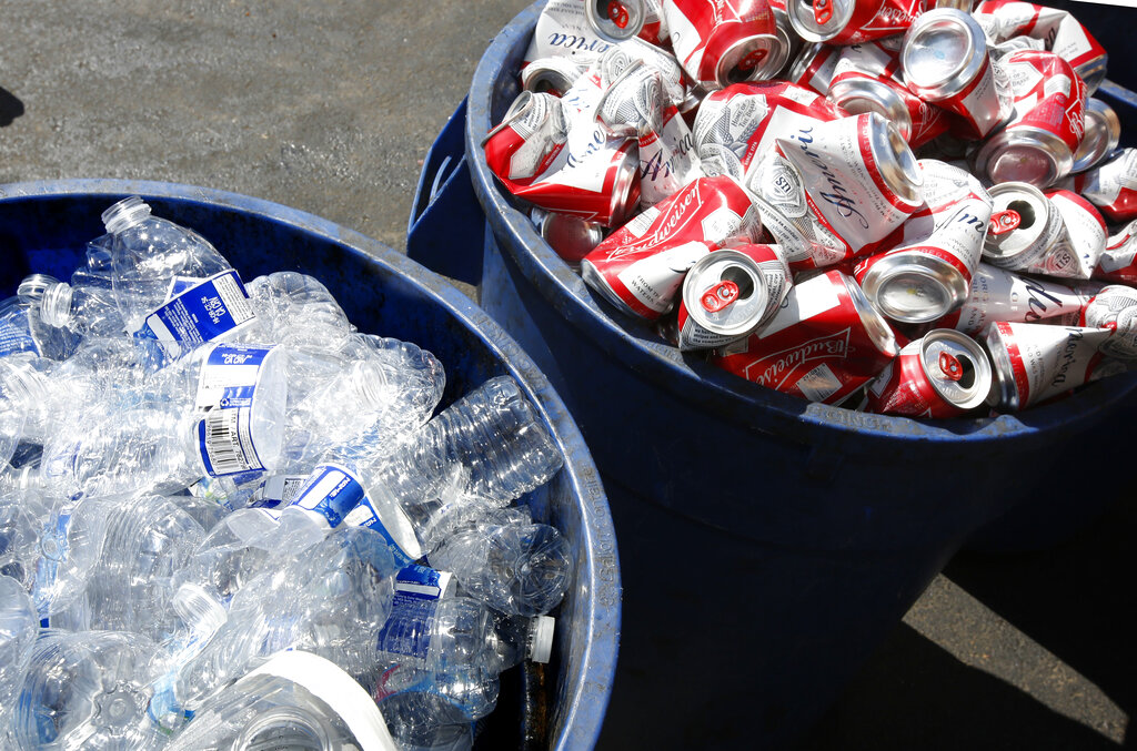 In this July 5, 2016, file photo, cans and plastic bottles brought in for recycling fill containers at a recycling center in Sacramento, Calif. (AP Photo/Rich Pedroncelli, File)