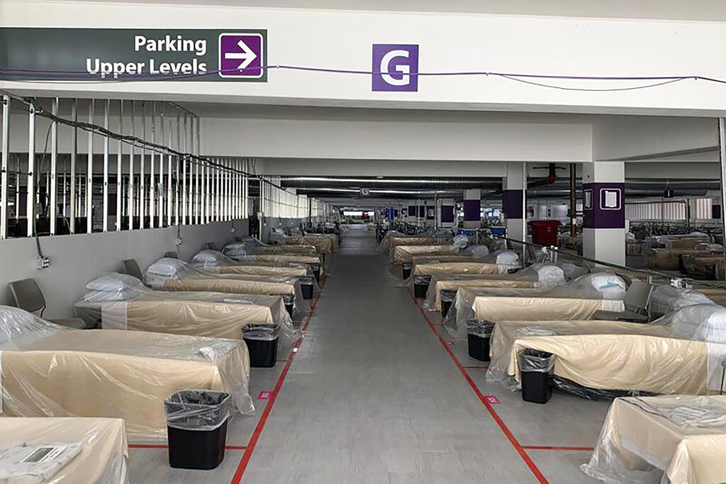 Hospital beds sit inside Renown Regional Medical Center's parking garage, which has been transformed into an alternative care site for COVID-19 patients in Reno, Nev., on on Nov. 11, 2020. (Lucia Starbuck/KUNR Public Radio/Report for America via AP)