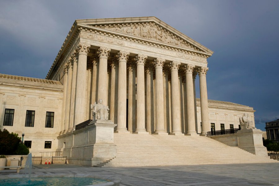 In this May 3, 2020, file photo, the setting sun shines on the Supreme Court building in Washington. (AP Photo/Patrick Semansky, File)