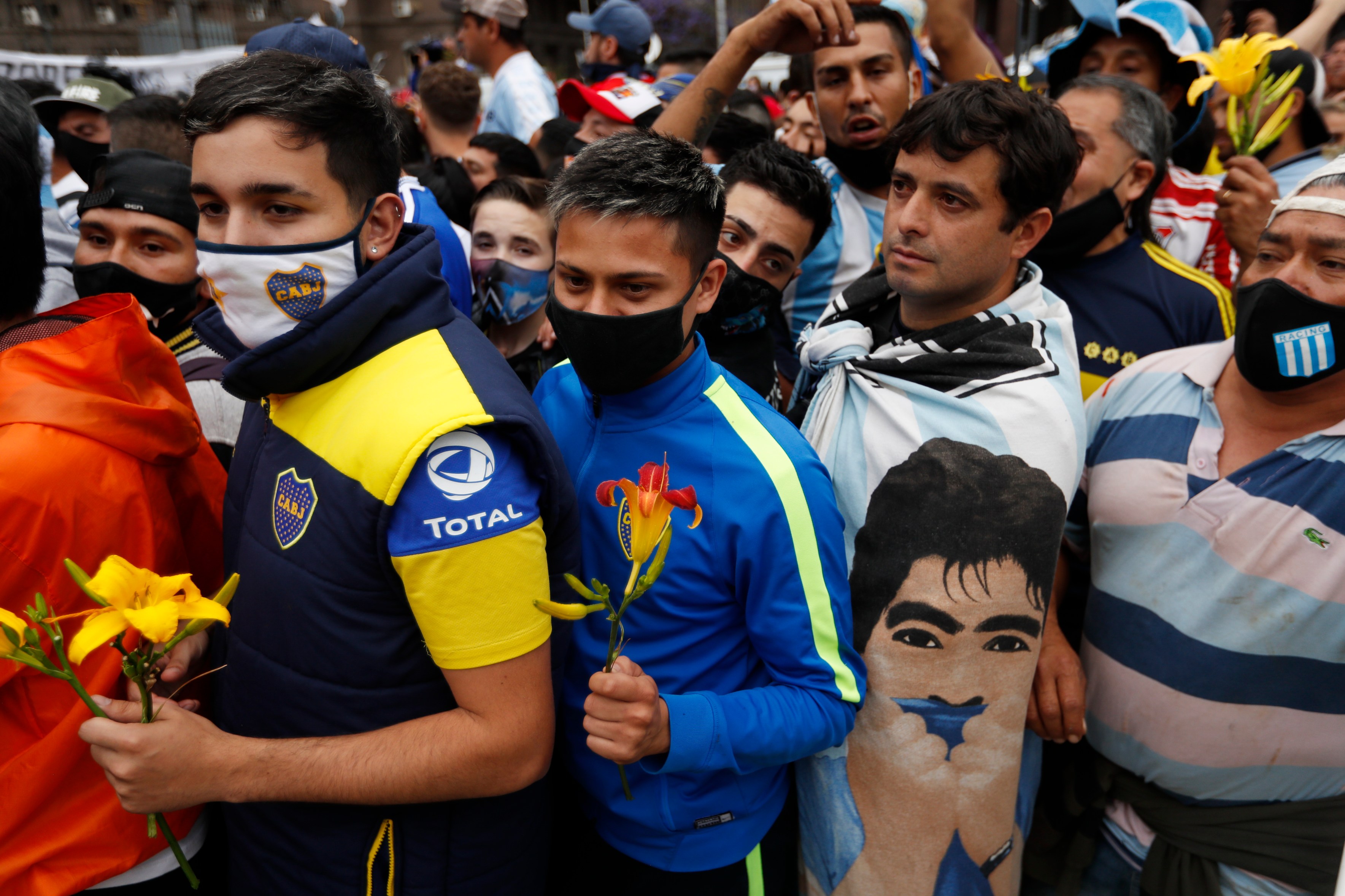 Soccer fans line up to see the casket with the body of Diego Maradona at the presidential palace in Buenos Aires on Nov. 26, 2020. (Natacha Pisarenko / Associated Press)