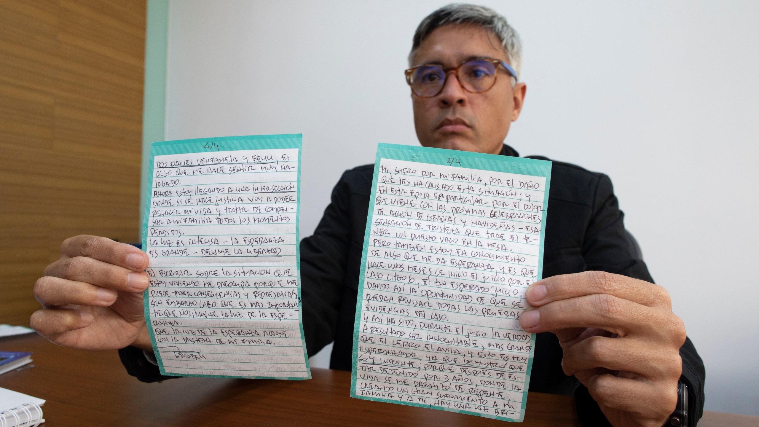 Jesus Loreto, an attorney representing Tomeu Vadell, one of six U.S. oil executives jailed for three years in Venezuela, shows a letter written by Vadell, in Caracas, Venezuela, Wednesday, Nov. 25, 2020. (Ariana Cubillos/AP Photo)