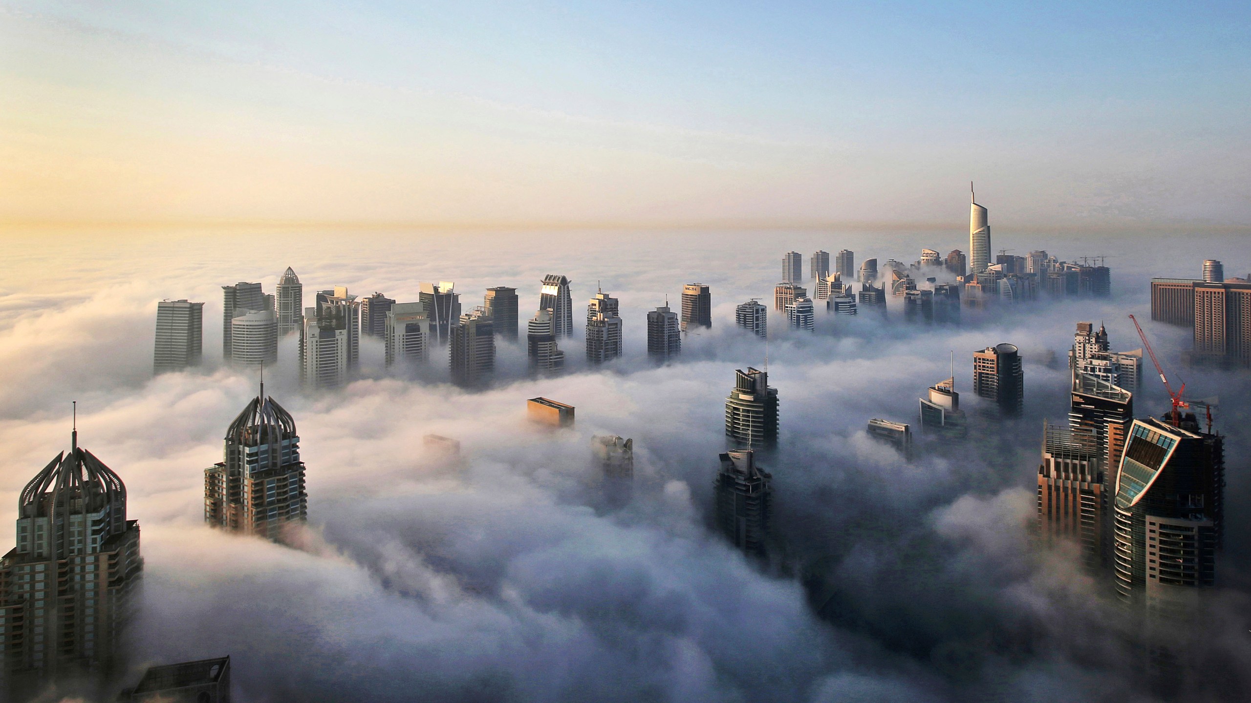 In this Monday, Oct. 5, 2015 file photo, a thick blanket of early morning fog partially shrouds the skyscrapers of the Marina and Jumeirah Lake Towers districts of Dubai, United Arab Emirates. (Kamran Jebreili/AP Photo)