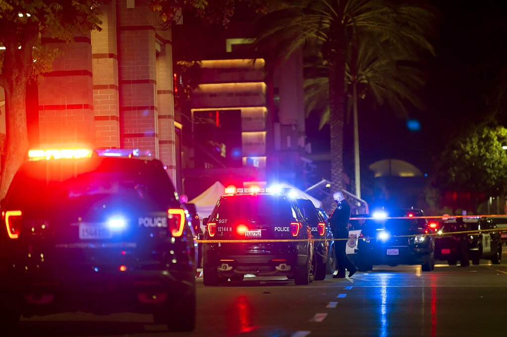 Police stand outside Arden Fair Mall after a shooting that left one person dead and another critically injured, Friday, Nov. 27, 2020, in Sacramento, Calif. (Paul Kitagaki Jr./The Sacramento Bee via AP)