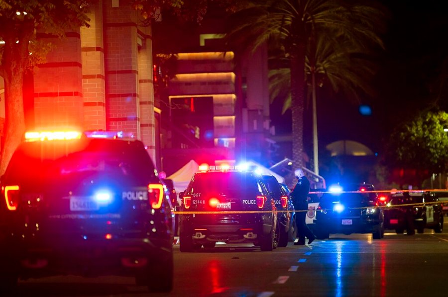 Police stand outside Arden Fair Mall after a shooting that left one person dead and another critically injured, Friday, Nov. 27, 2020, in Sacramento, Calif. (Paul Kitagaki Jr./The Sacramento Bee via AP)