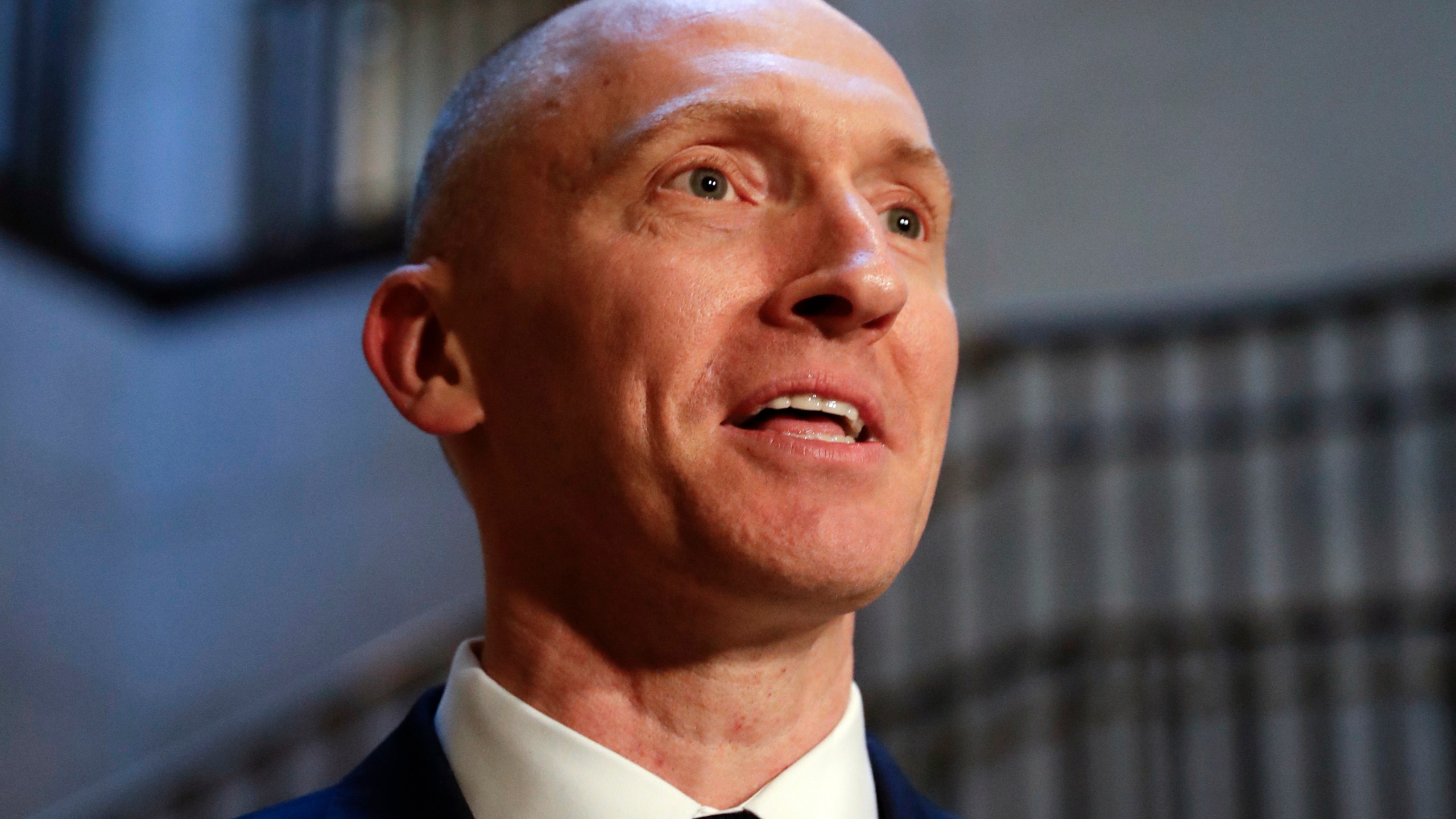 In this Nov. 2, 2017, photo, Carter Page, a foreign policy adviser to Donald Trump's 2016 presidential campaign, speaks with reporters following a day of questions from the House Intelligence Committee, on Capitol Hill in Washington. Page, who was the target of a secret surveillance warrant during the FBI’s Russia investigation says in a federal lawsuit filed Friday, Nov. 27, 2020, that he was the victim of “unlawful spying.” The suit from Carter Page alleges a series of omissions and errors made by FBI and Justice Department officials in applications they submitted to the Foreign Intelligence Surveillance Court to eavesdrop on Page on suspicion that he was an agent of Russia. (AP Photo/J. Scott Applewhite)