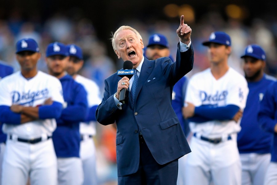 In this May 3, 2017, file photo, Los Angeles Dodgers broadcaster Vin Scully speaks during his induction into the team's Ring of Honor prior to a baseball game between the Dodgers and the San Francisco Giants, in Los Angeles. (AP Photo/Mark J. Terrill, File)