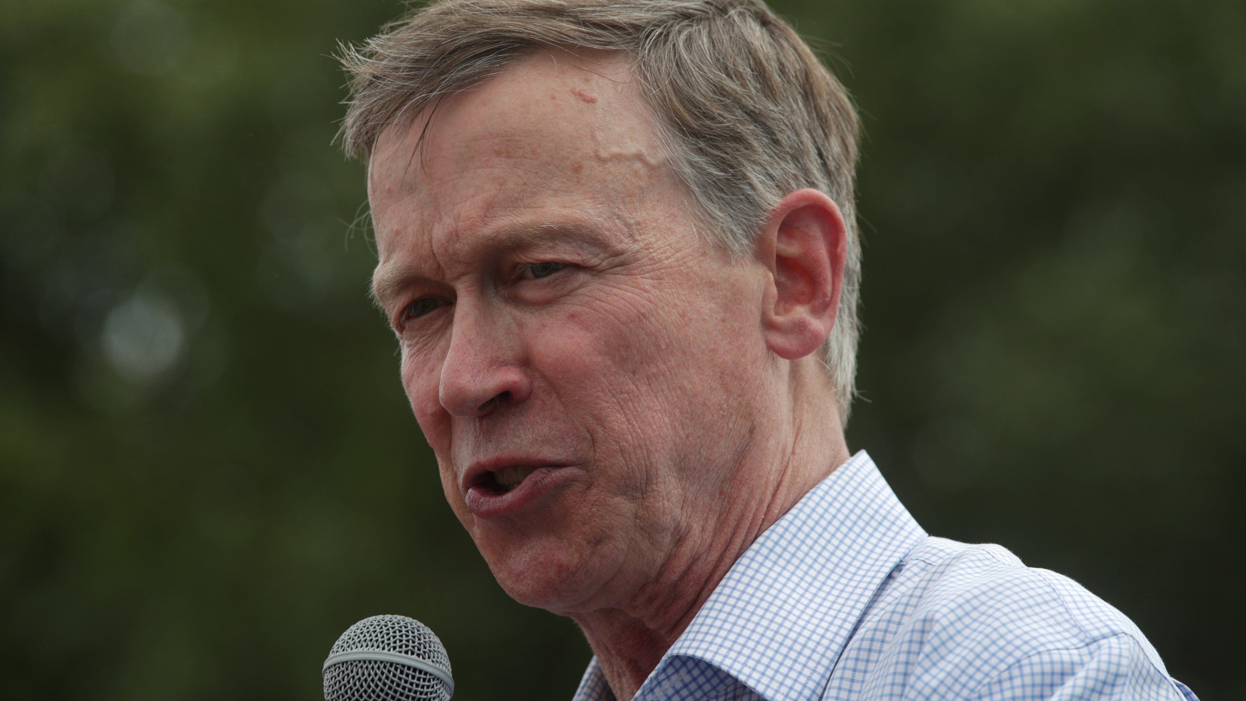 Former Colorado Gov. John Hickenlooper delivers a campaign speech at the Des Moines Register Political Soapbox at the Iowa State Fair during the Democratic presidential primary on August 10, 2019 in Des Moines, Iowa. (Alex Wong/Getty Images)