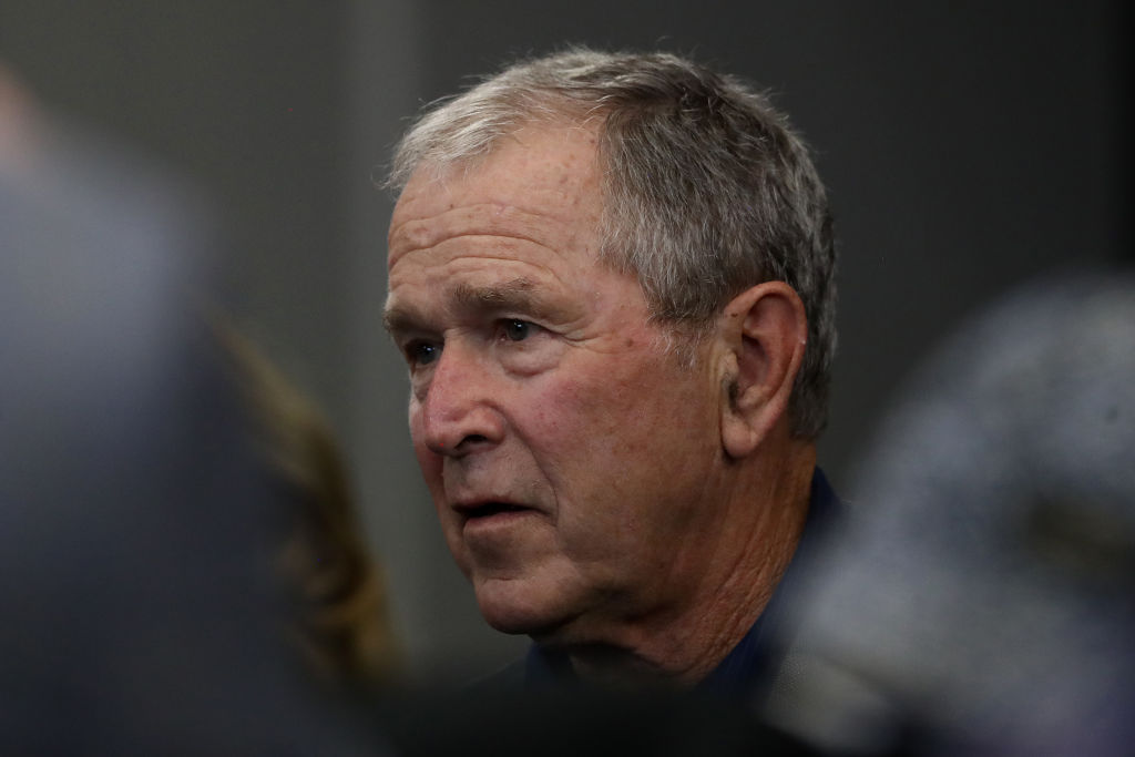 Former President George W. Bush attends the NFL game between the Dallas Cowboys and the Green Bay Packers at AT&T Stadium in Arlington, Texas, on Oct. 6, 2019. (Ronald Martinez / Getty Images)