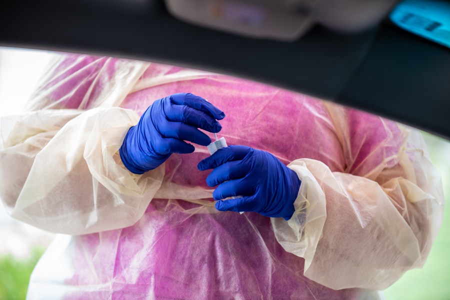 A nurse prepares to swab a patient at a coronavirus testing center in this file photo from July 7, 2020 in Austin, Texas. (Sergio Flores/Getty Images)