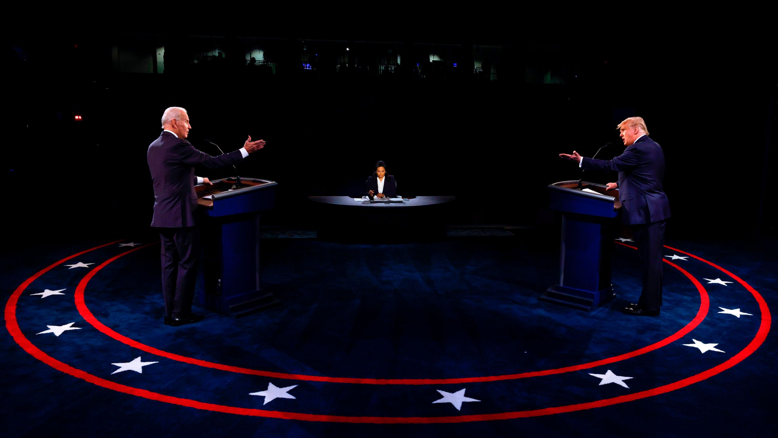 President Donald Trump, Democratic Presidential candidate Joe Biden and moderator, NBC News anchor, Kristen Welker participate in the final presidential debate at Belmont University in Nashville, Tennessee, on Oct. 22, 2020. (JIM BOURG/POOL/AFP via Getty Images)