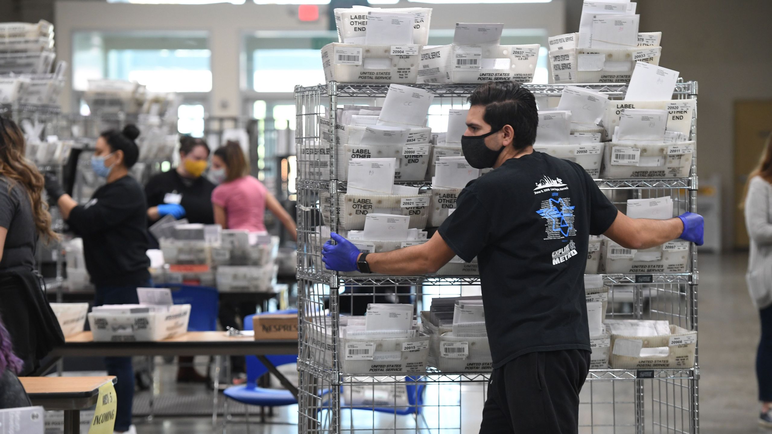 Mail-in ballots for the US presidential election are sorted at the Los Angeles County Registrar Recorders' mail-in ballot processing center at the Pomona Fairplex in Pomona, California, October 28, 2020. (Robyn Beck/AFP via Getty Images)