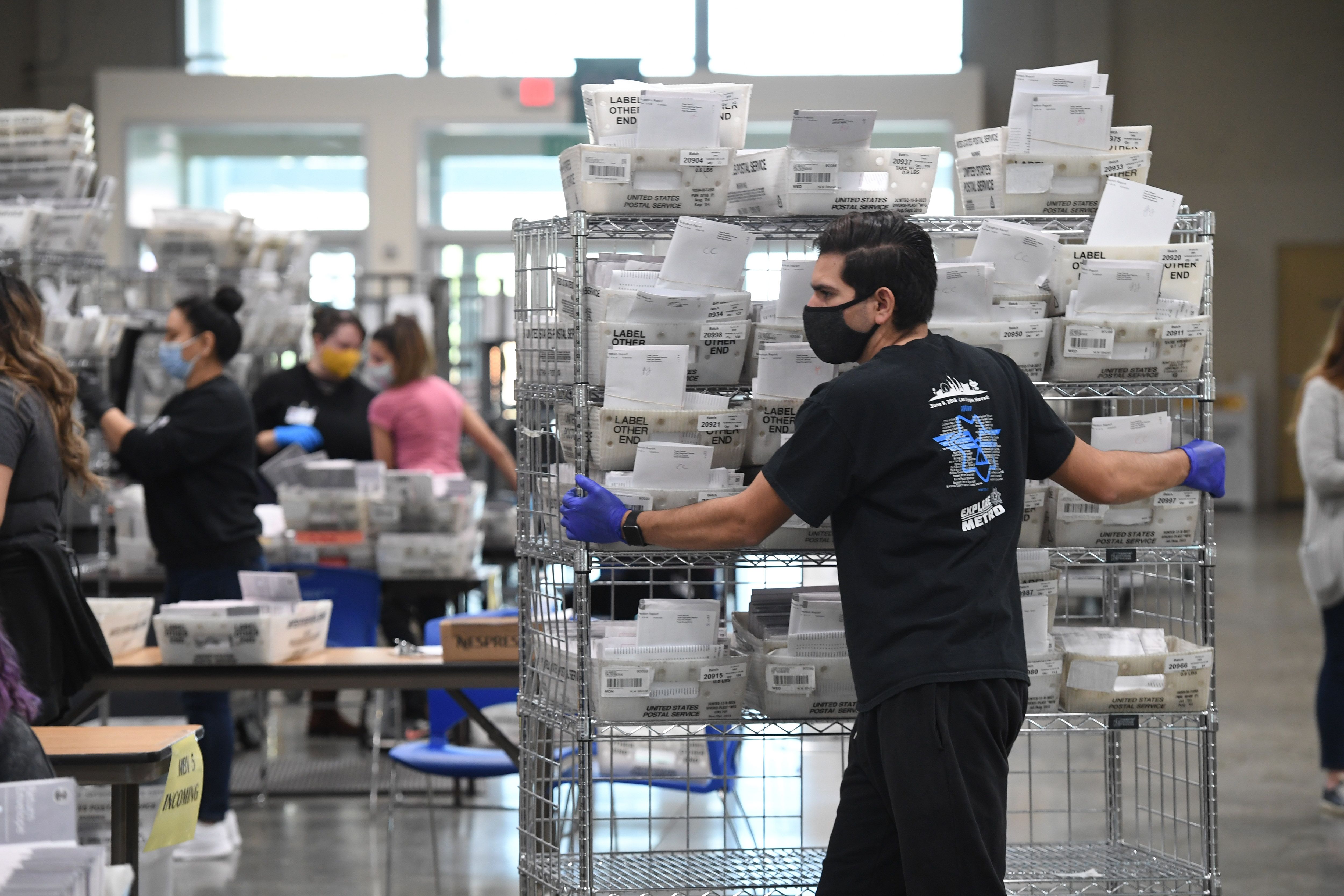 Mail-in ballots for the US presidential election are sorted at the Los Angeles County Registrar Recorders' mail-in ballot processing center at the Pomona Fairplex in Pomona, California, October 28, 2020. (Robyn Beck/AFP via Getty Images)