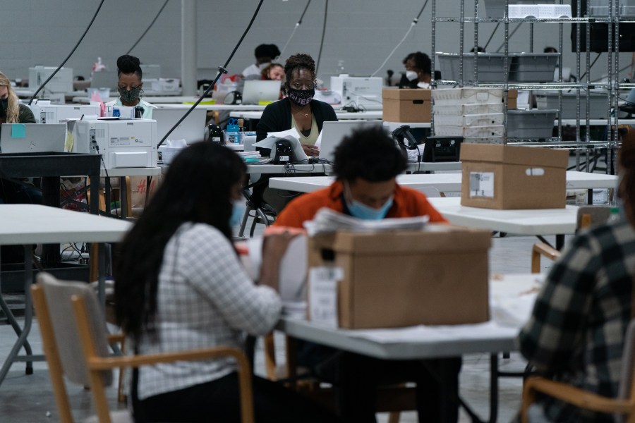 Election personnel sort ballots in preparation for an audit at the Gwinnett County Board of Voter Registrations and Elections offices on Nov. 7, 2020, in Lawrenceville, Georgia. (Elijah Nouvelage/Getty Images)