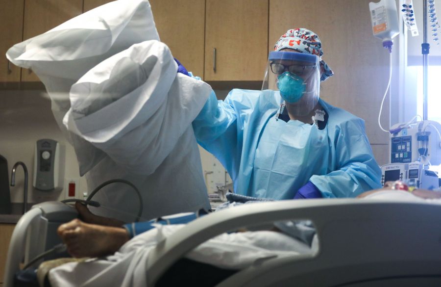 A nurse cares for a COVID-19 patient in the Intensive Care Unit (ICU) at El Centro Regional Medical Center in hard-hit Imperial County on July 28, 2020 in El Centro, California. ( Mario Tama/Getty Images)