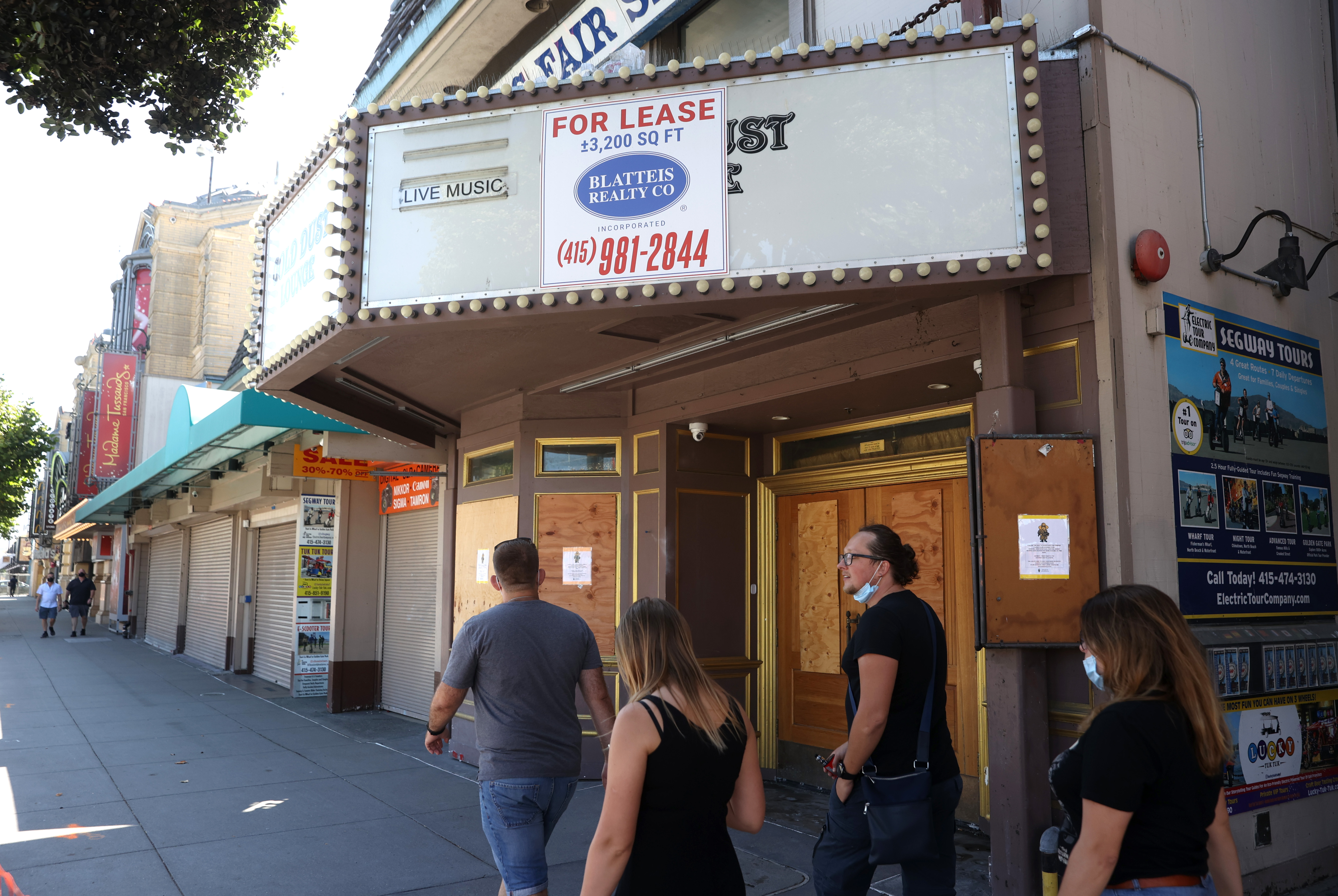 Pedestrians walk by the closed Gold Dust Lounge on Aug. 13, 2020 in San Francisco. (Justin Sullivan/Getty Images)