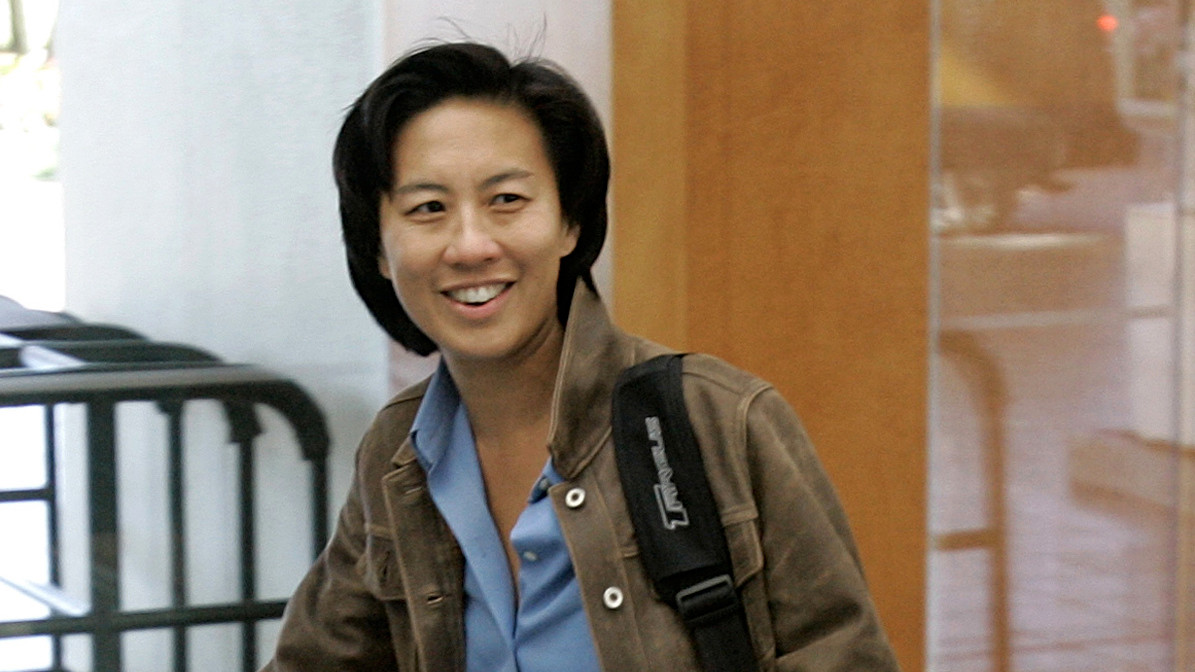 In this Nov. 5, 2007 file photo, Los Angeles Dodgers assistant general manager Kim Ng walks through the hotel lobby during the first day of Major League Baseball annual general managers meetings in Orlando, Fla. Ng has become the highest-ranking woman in baseball operations in the major leagues. She was hired Friday, Nov. 13, 2020, as general manager of the Miami Marlins. (AP Photo/John Raoux, file)