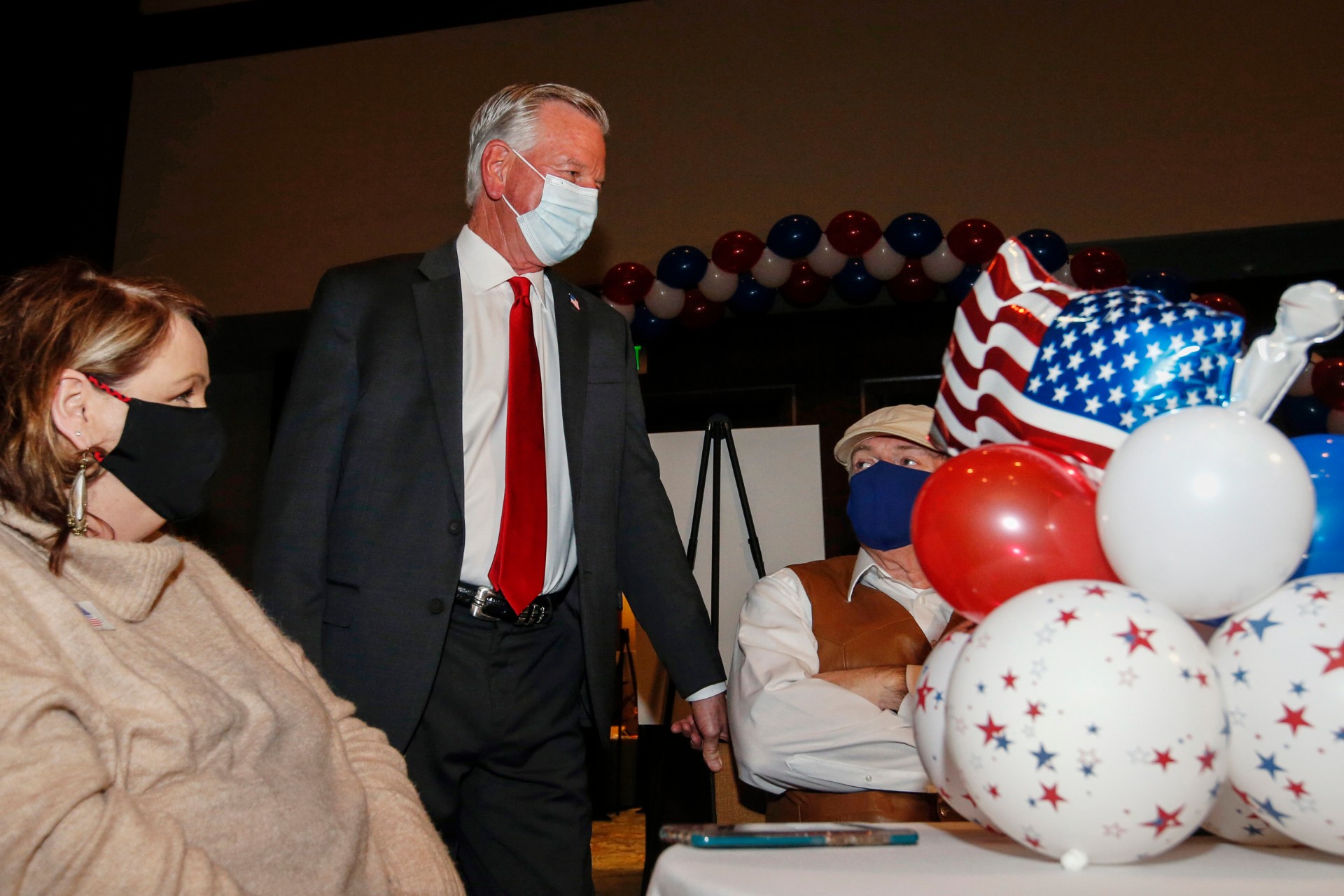 Republican U.S. Senate candidate Tommy Tuberville talks with guest as he arrives for the watch party at the Renaissance Hotel on Tuesday, Nov. 3, 2020, in Montgomery, Ala. (AP Photo/Butch Dill)