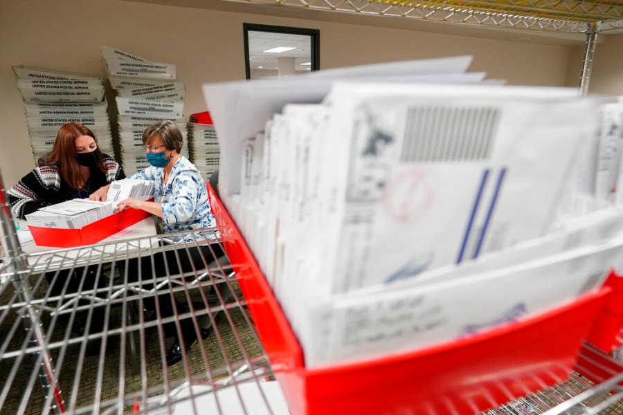 Lehigh County workers count ballots as vote counting in the general election continues, Thursday, Nov. 5, 2020, in Allentown, Pa. (AP Photo/Mary Altaffer)