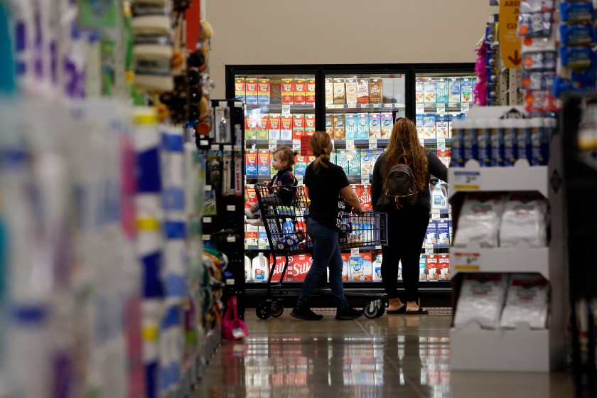 People shop at a Smart & Final Extra! at Jordan Downs Plaza in Watts. The California Grocers Assn. is urging consumers to try to avoid crowds.(Dania Maxwell / Los Angeles Times)