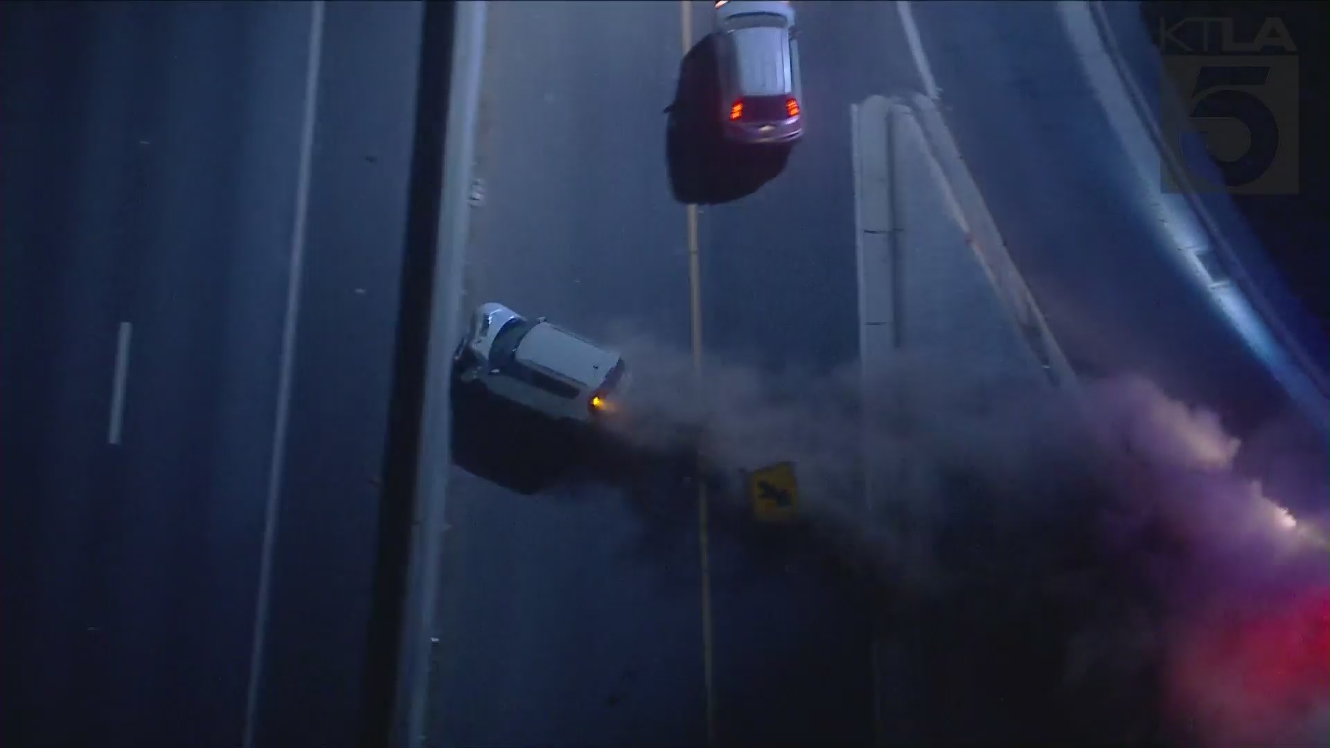 A car slams into a freeway center divider in Bell after leading authorities on a chase on Nov. 6, 2020. (KTLA)