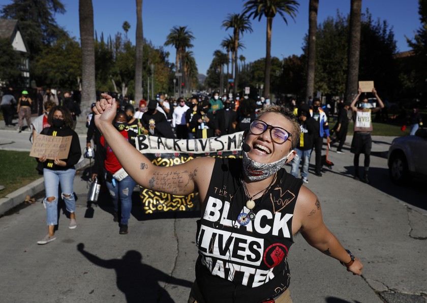 Tekoah Flory, with Black Lives Matter-Los Angeles, participates in a demonstration outside Mayor Eric Garcetti’s home on Nov. 30, 2020. (Christina House / Los Angeles Times)