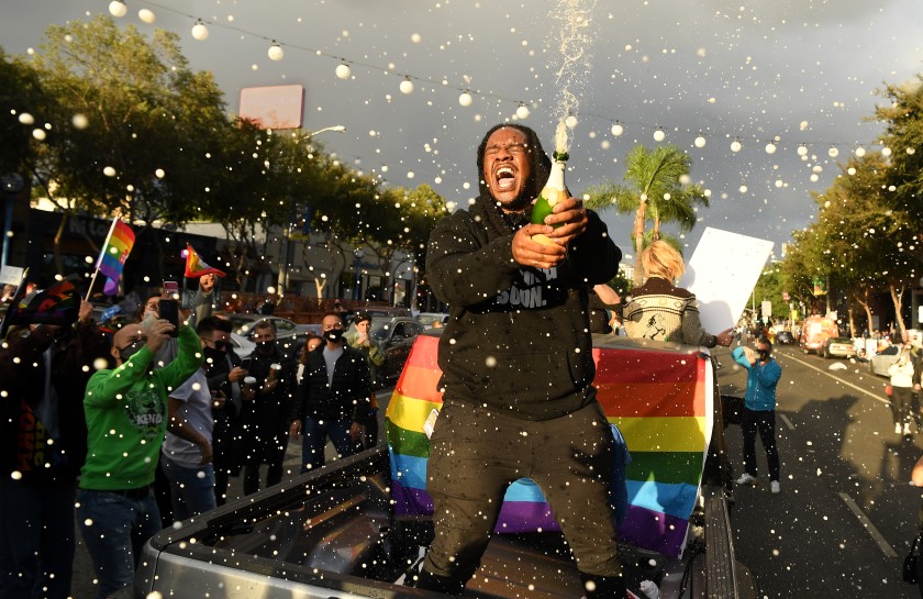 On streets across the country, revelers chanted along to the 2016 protest song “FTD” as they celebrated the victory of Joe Biden over President Trump. (Wally Skalij/Los Angeles Times)