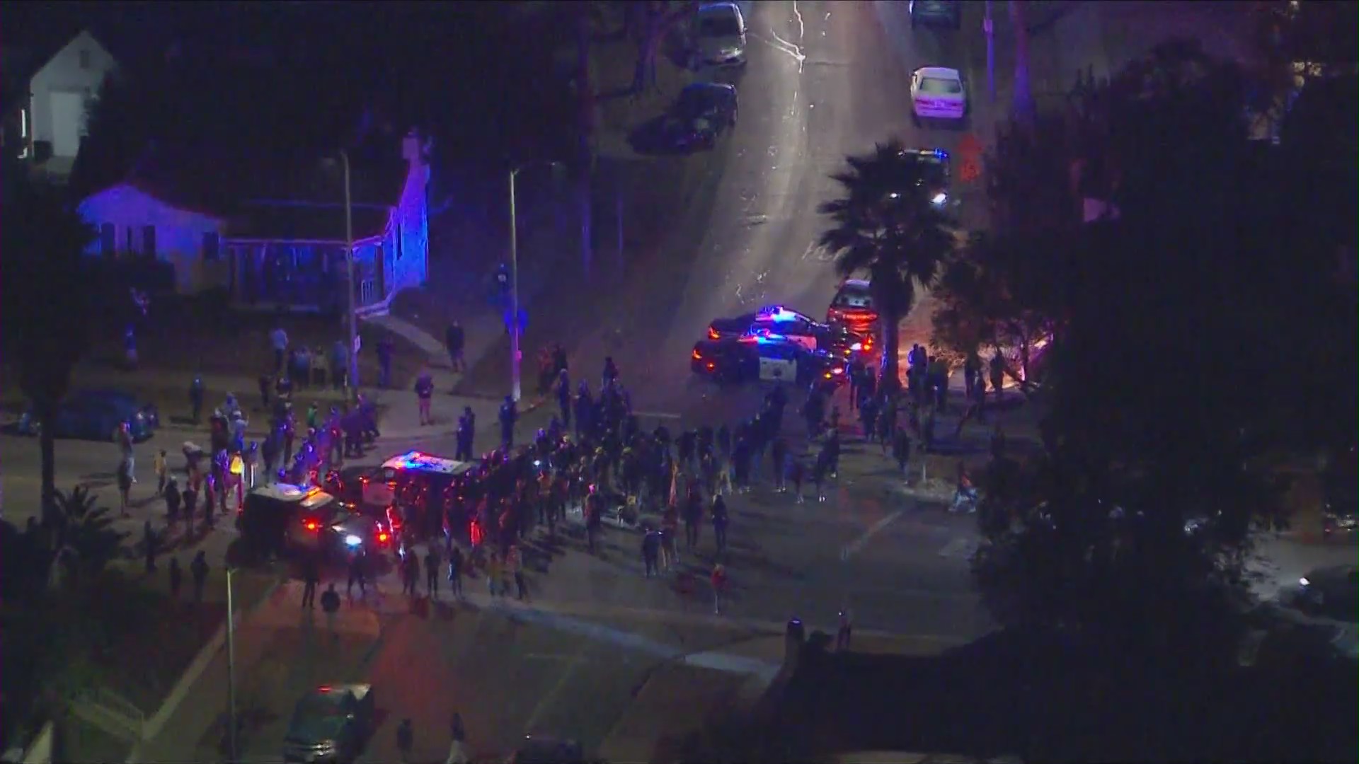 California Highway Patrol officers on Wednesday evening faced off with housing rights activists at an El Sereno neighborhood where vacant Caltrans-owned homes were being occupied. (KTLA)