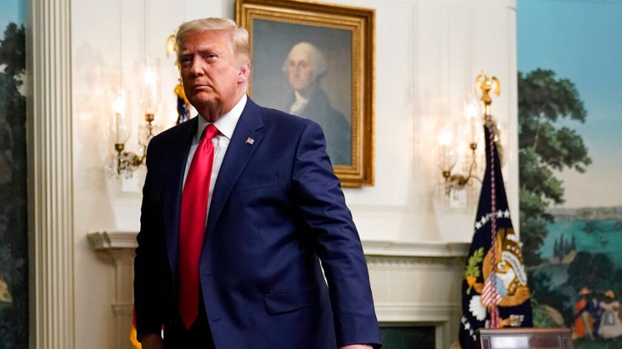 President Donald Trump departs after participating in a video teleconference call with members of the military on Thanksgiving, Thursday, Nov. 26, 2020, at the White House in Washington. (AP Photo/Patrick Semansky)