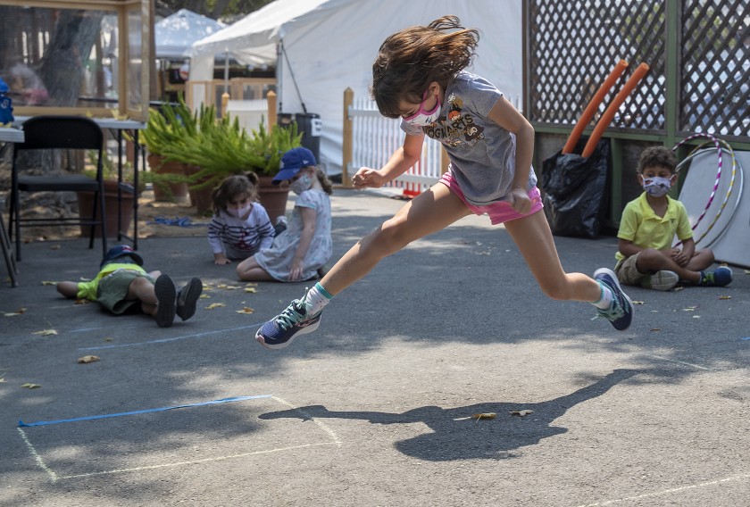 Tabitha Sirignano, a 3rd-grader, jumps while playing a game with other students during an exercise period in Culver City in this undated photo. (Melcon/Los Angeles Times)