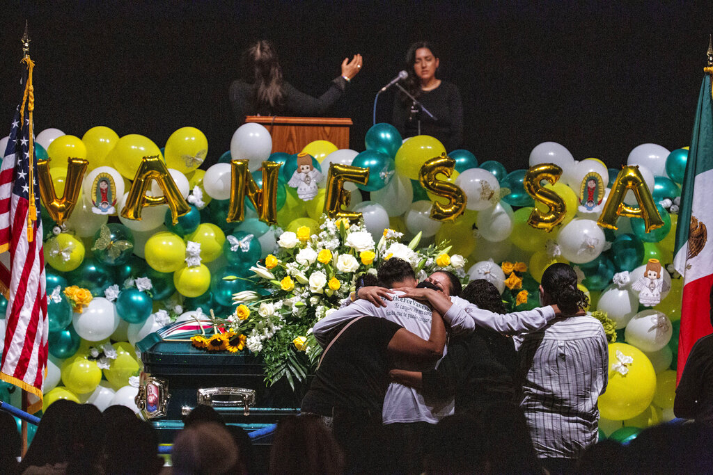 In this Aug. 14, 2020, file photo Alma Garcia embraces Juan Cruz, the boyfriend of Army Spc. Vanessa Guillen at her memorial service on in Houston. (Marie D. De Jesus/Houston Chronicle via AP, Pool, File)