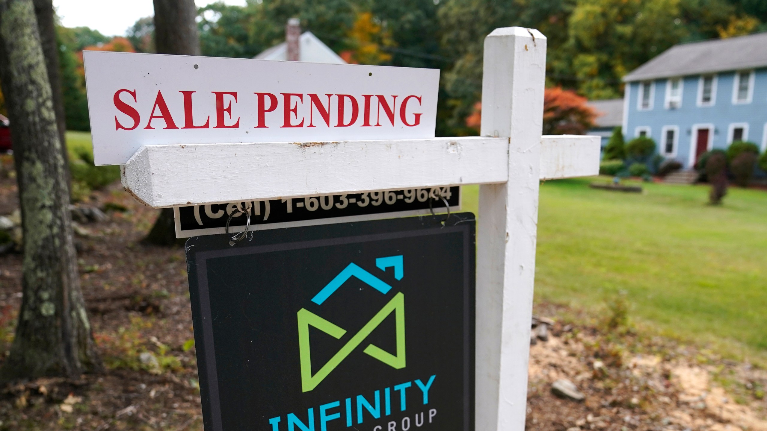 In this Sept. 29, 2020 file photo, a sale pending sign is displayed outside a residential home for sale in East Derry, N.H. (AP Photo/Charles Krupa, File)